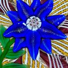 Signed Paul Ysart Glass Art Paperweight Flamework Aventurine and Blue Petaled Clematis on a Colorful Filigree Crown Cushion