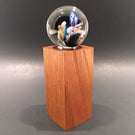 Unsigned Josh Simpson Art Glass Marble Inhabited Planet & Wood Stand