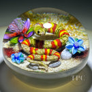 Ken Rosenfeld 2023 Glass Art Paperweight Flamework Yellow & Red Banded Snake on Sand with Pebbles & Perennial Flowers