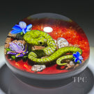 Ken Rosenfeld 2023 Glass Art Paperweight Flamework Green Scaled Snake on Red Sand with Pebbles, Aventurine, and Perennial Flowers