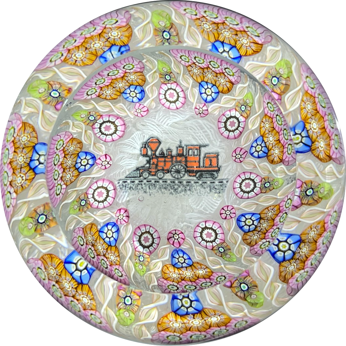 Perthshire Paperweights PP56 Patterned Complex Millefiori on Upset Muslin Cushion with a Train Decal