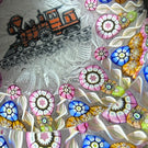 Perthshire Paperweights PP56 Patterned Complex Millefiori on Upset Muslin Cushion with a Train Decal