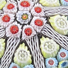 Vintage Strathearn Glass Art Paperweight Colorful Paneled Millefiori and White Filigree on Opaque Black Ground