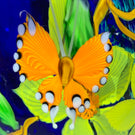 Mayauel Ward 2019 Compound Torchwork Orange Swallowtail Butterfly with Yellow Blossoms on Blue