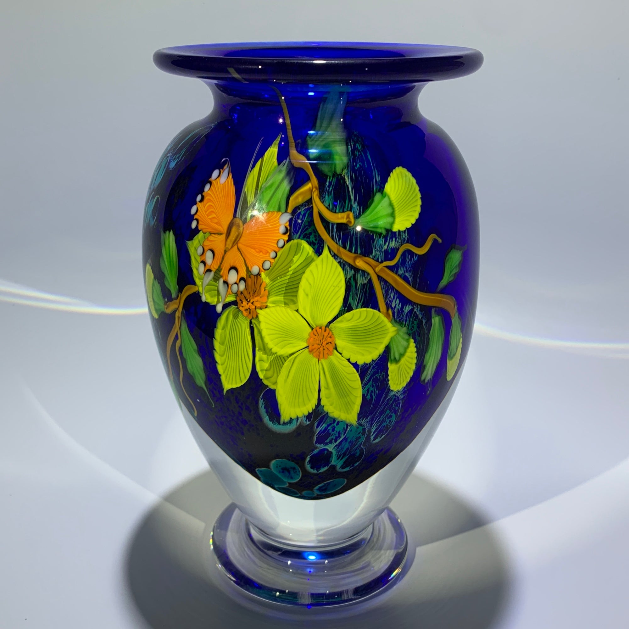 Mayauel Ward 2019 Compound Torchwork Orange Swallowtail Butterfly with Yellow Blossoms on Blue