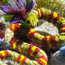 Ken Rosenfeld 2023 Glass Art Paperweight Flamework Yellow & Red Banded Snake on Sand with Pebbles & Perennial Flowers