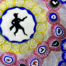 Baccarat Crystal 1974 L'Homme Au Fusil Gridel Hunter with Rifle Murrine Interlaced Complex Millefiori Garland & 17 Silhouettes on Upset White Muslin Lace